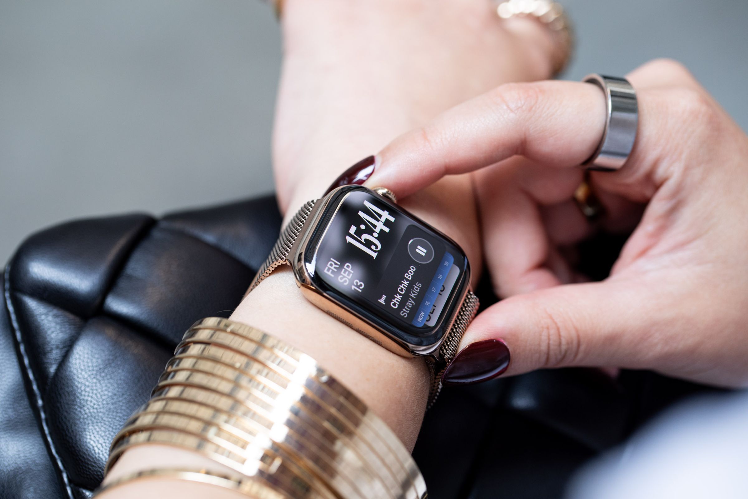 Person looking at music widget on Apple Watch Series 10