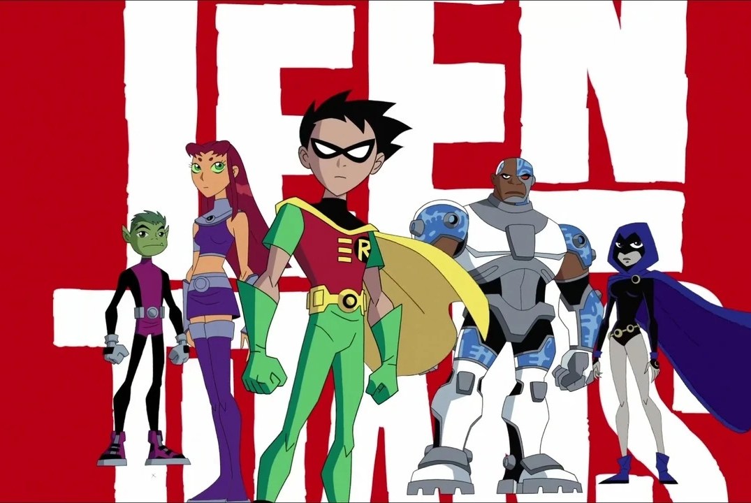 Five teenage superheroes stand in front of a stylized white logo and red background that reads, “Teen Titans.”