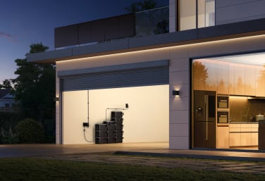 an open garage with the DJI power 2000 portable power station and many backup batteries